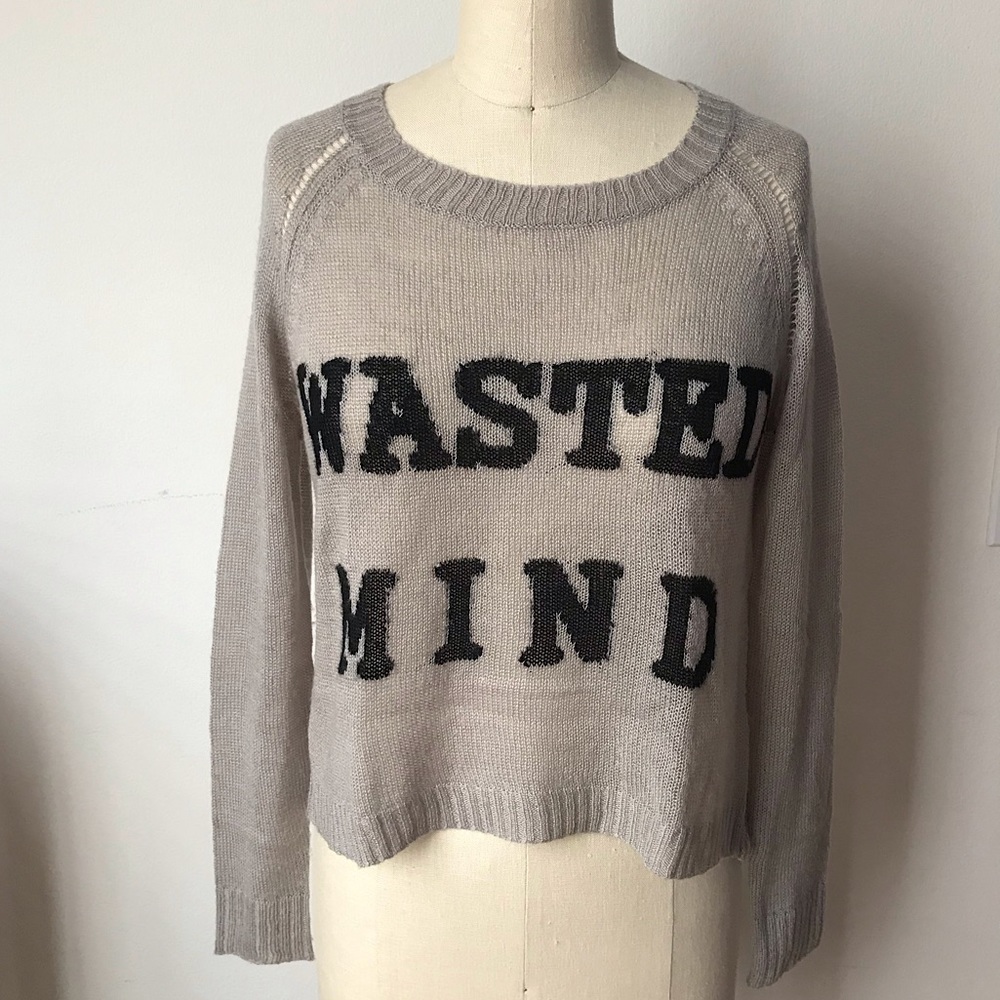 Light grey sweater with open cross-over back